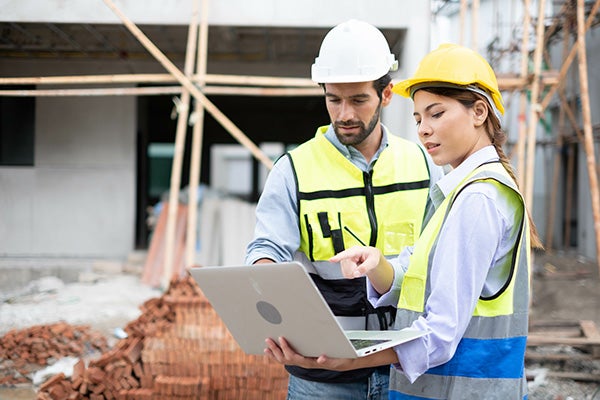 Engineers on building site.