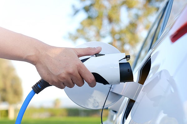 Electric car at charging at station